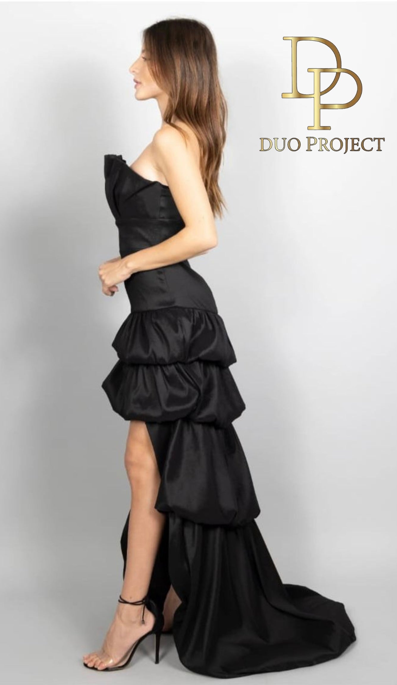 Strapless high low ruffle layered taffeta gown